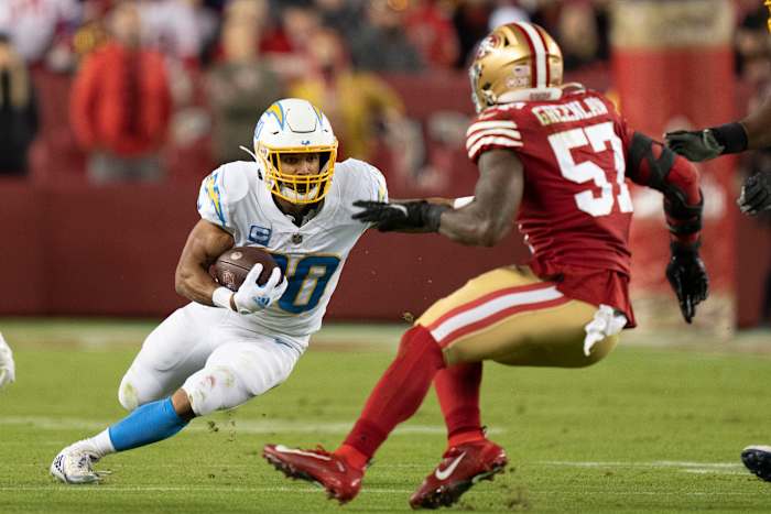 November 13, 2022; Santa Clara, California, USA; Los Angeles Chargers running back Austin Ekeler (30) runs with the football against San Francisco 49ers linebacker Dre Greenlaw (57) during the first quarter at Levi's Stadium. Mandatory Credit: Kyle Terada-USA TODAY Sports